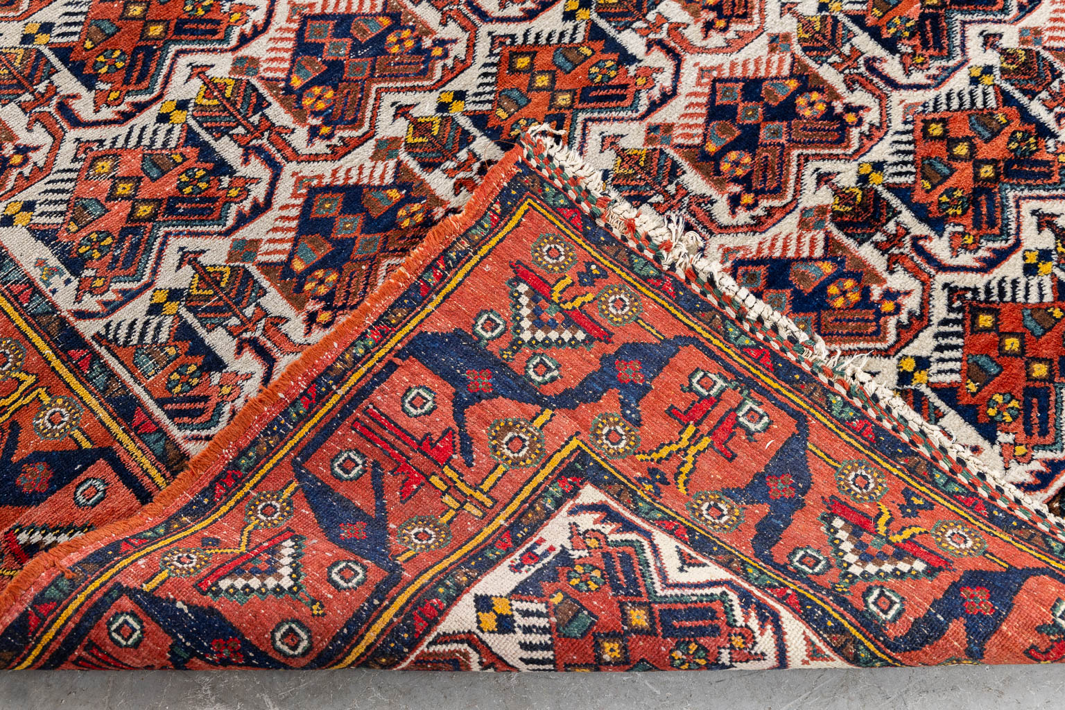 A Geometric Oriental hand-made carpet. (L:192 x W:157 cm)