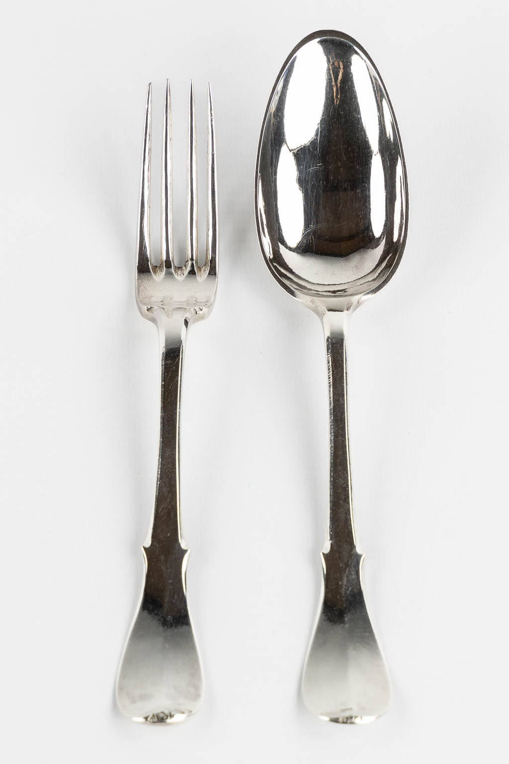 Pieter Frère, Bruges, a silver spoon and fork. 1779. (L:20 cm)