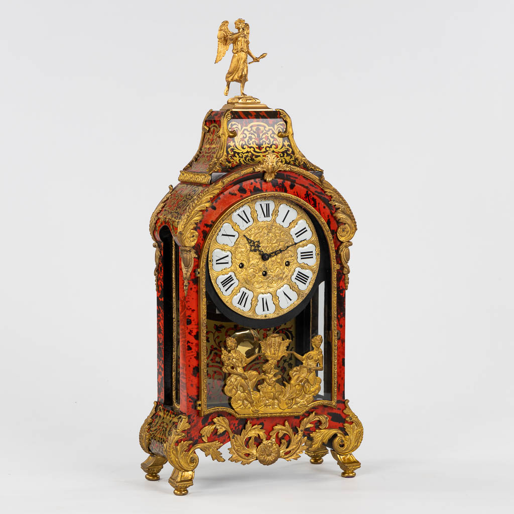 A large cartel clock, Faux Boulle in a Napoleon 3 style, mounted with gilt bronze. 20th C. (L:15 x W:40 x H:85 cm)