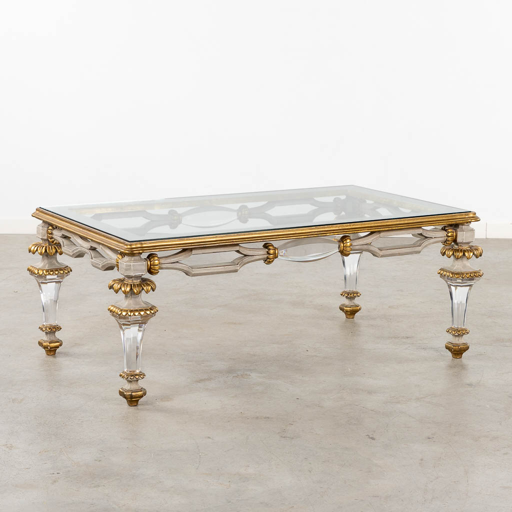 A Hollywood-Regency style coffee table, sculptured wood and plexiglass. (L:73 x W:120 x H:45 cm)