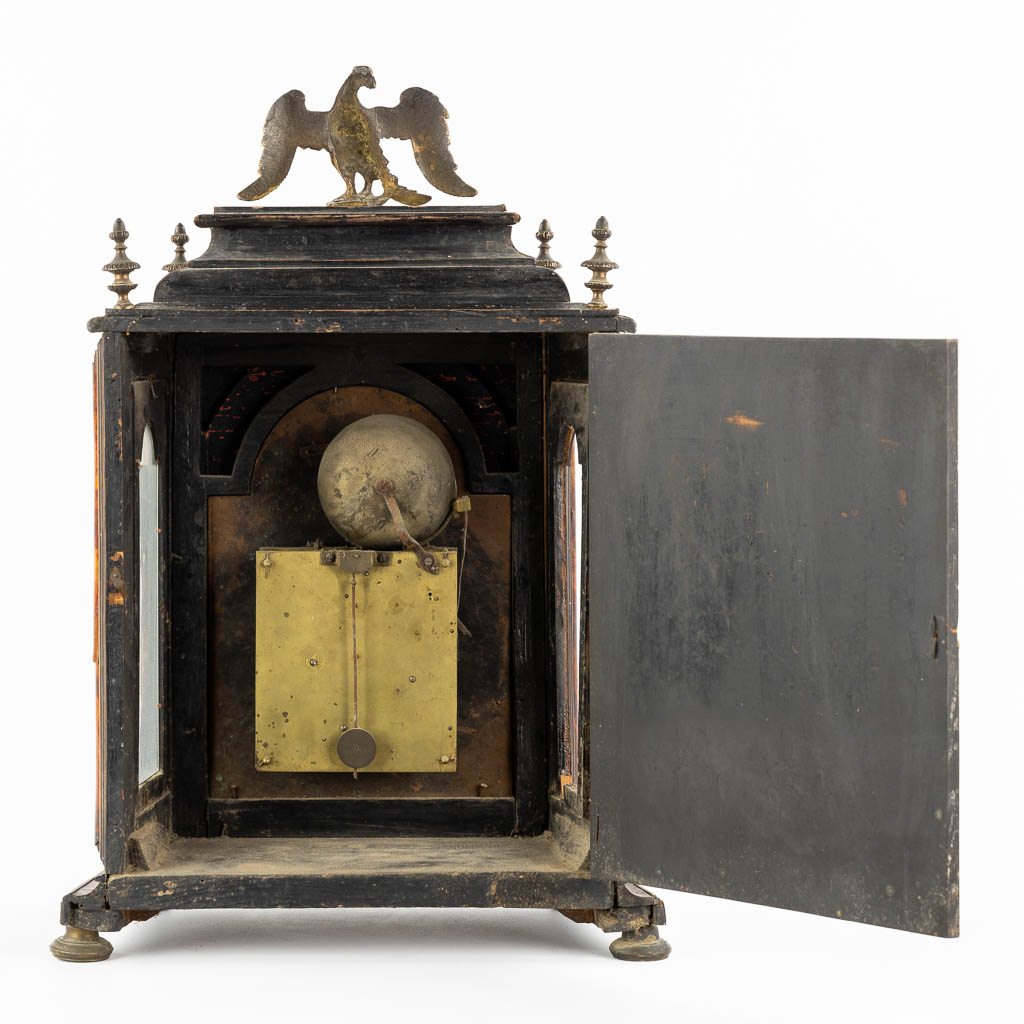 An antique Sicilian mantle clock, mounted with tortoiseshell and gilt bronze. Italy, 18th C. (L:20 x W:36 x H:53 cm)