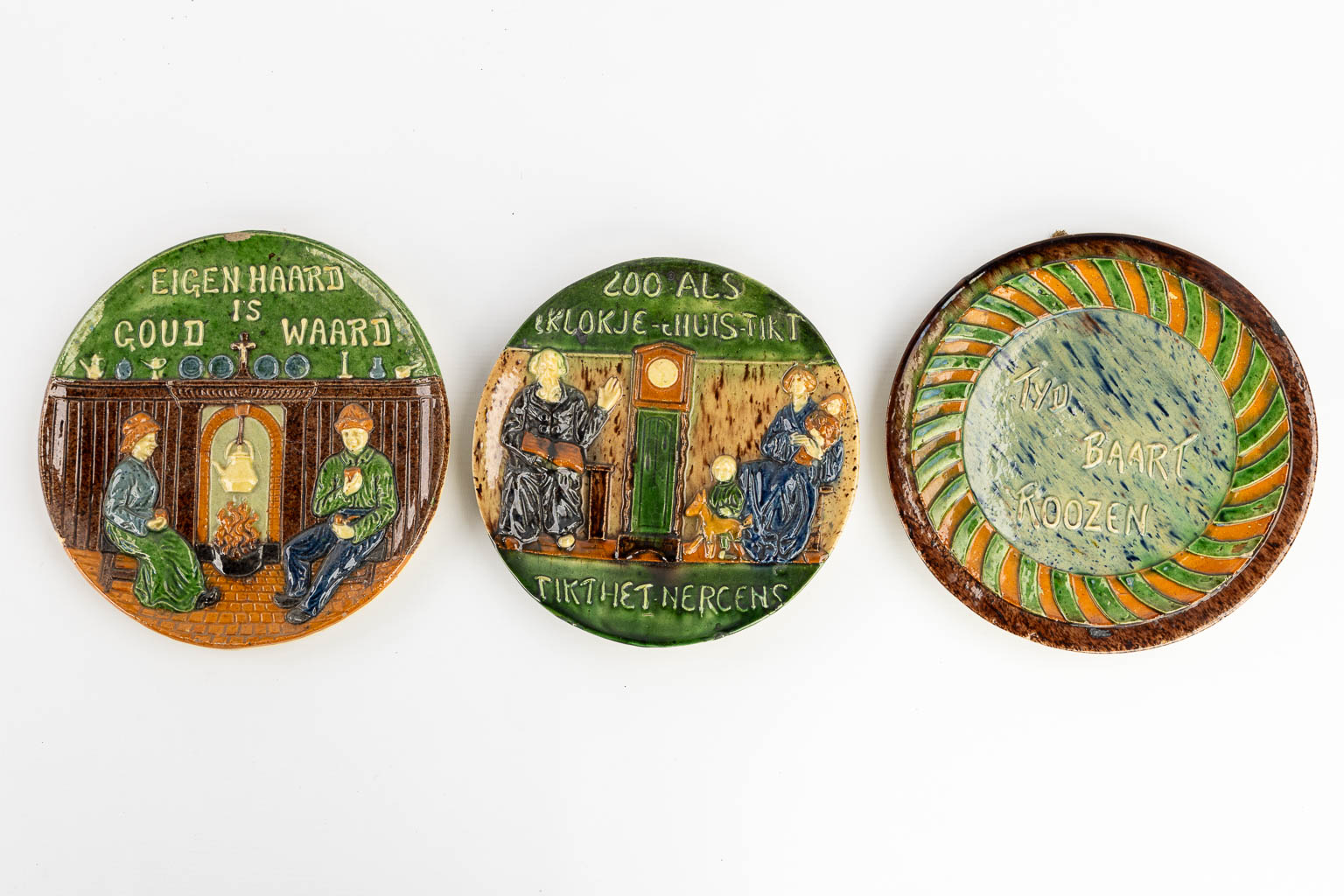 Eight plates with 'Proverbs and Sayings' made of Flemish Earthenware. 