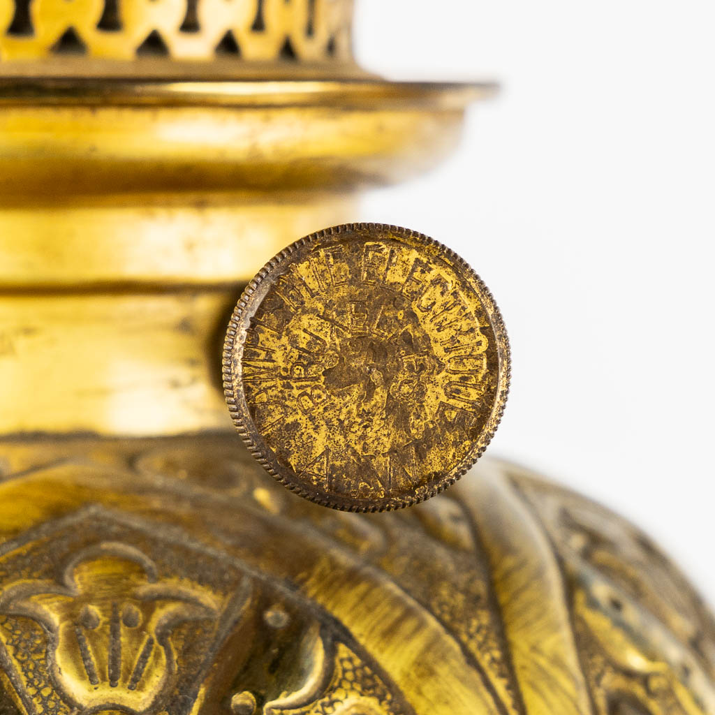 A pair of large oil lamps, porcelain and brass. Circa 1900. 