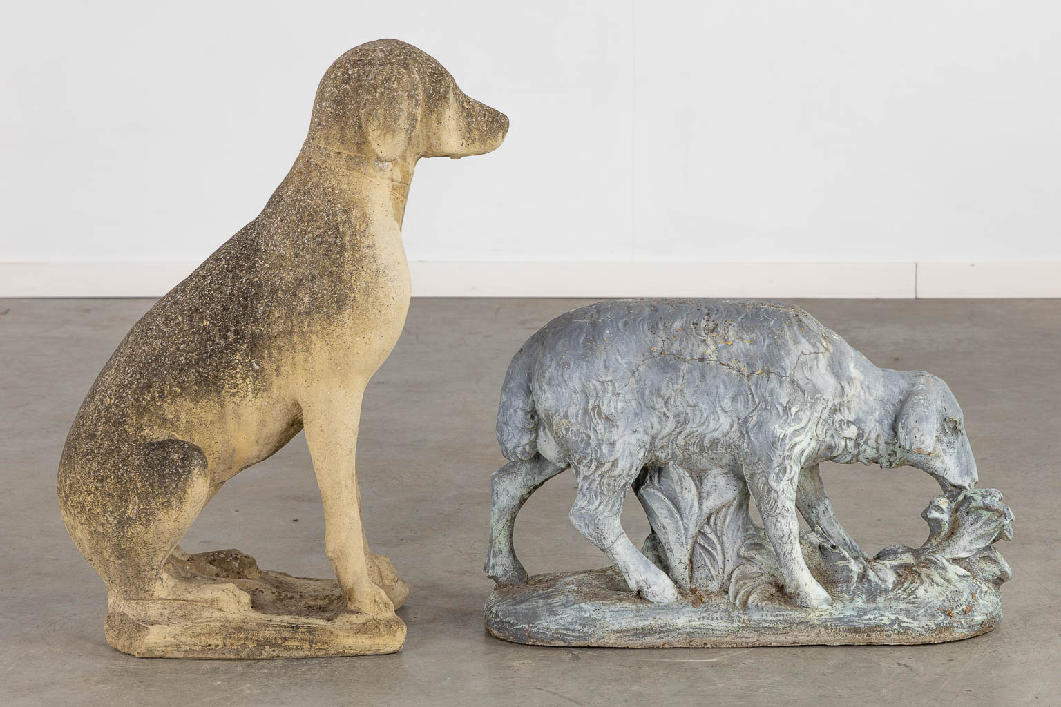 Two decorative garden statues of a dog and a sheep, concrete. (L:55 x W:28 x H:72 cm)