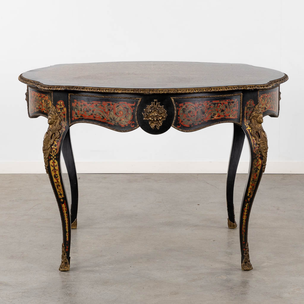 A game table, Napoleon 3 style, Imitation boulle mounted with bronze. 20th C. (L:120 x W:120 x H:79 cm)