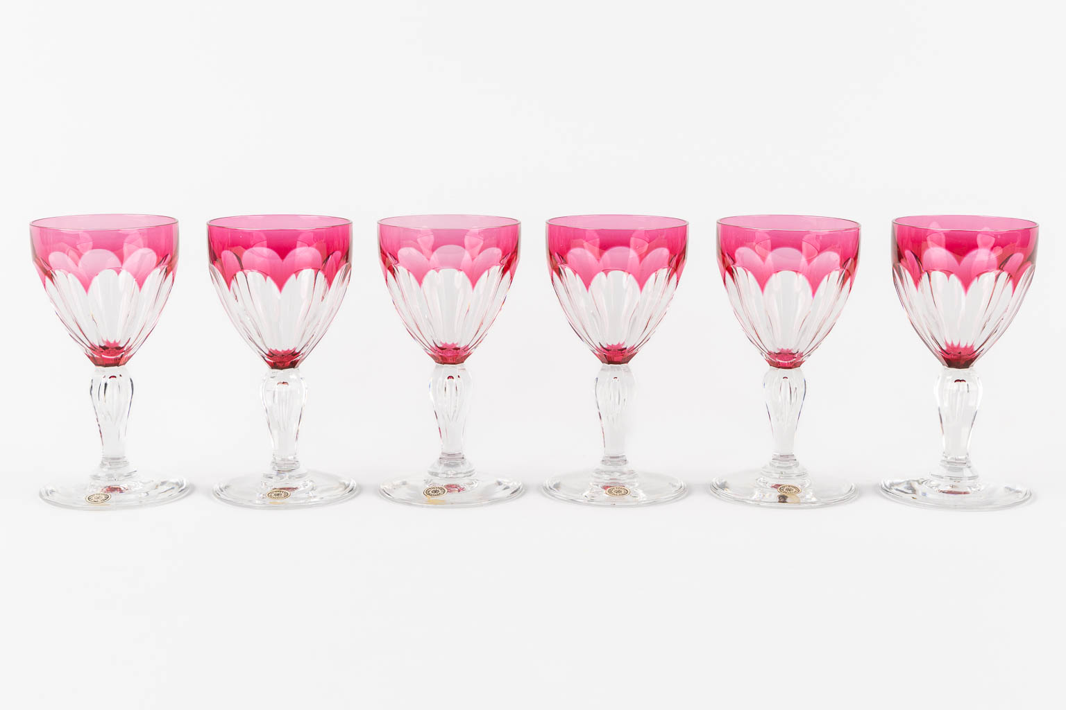 Val Saint Lambert, 36 coloured goblets and two carafes. 