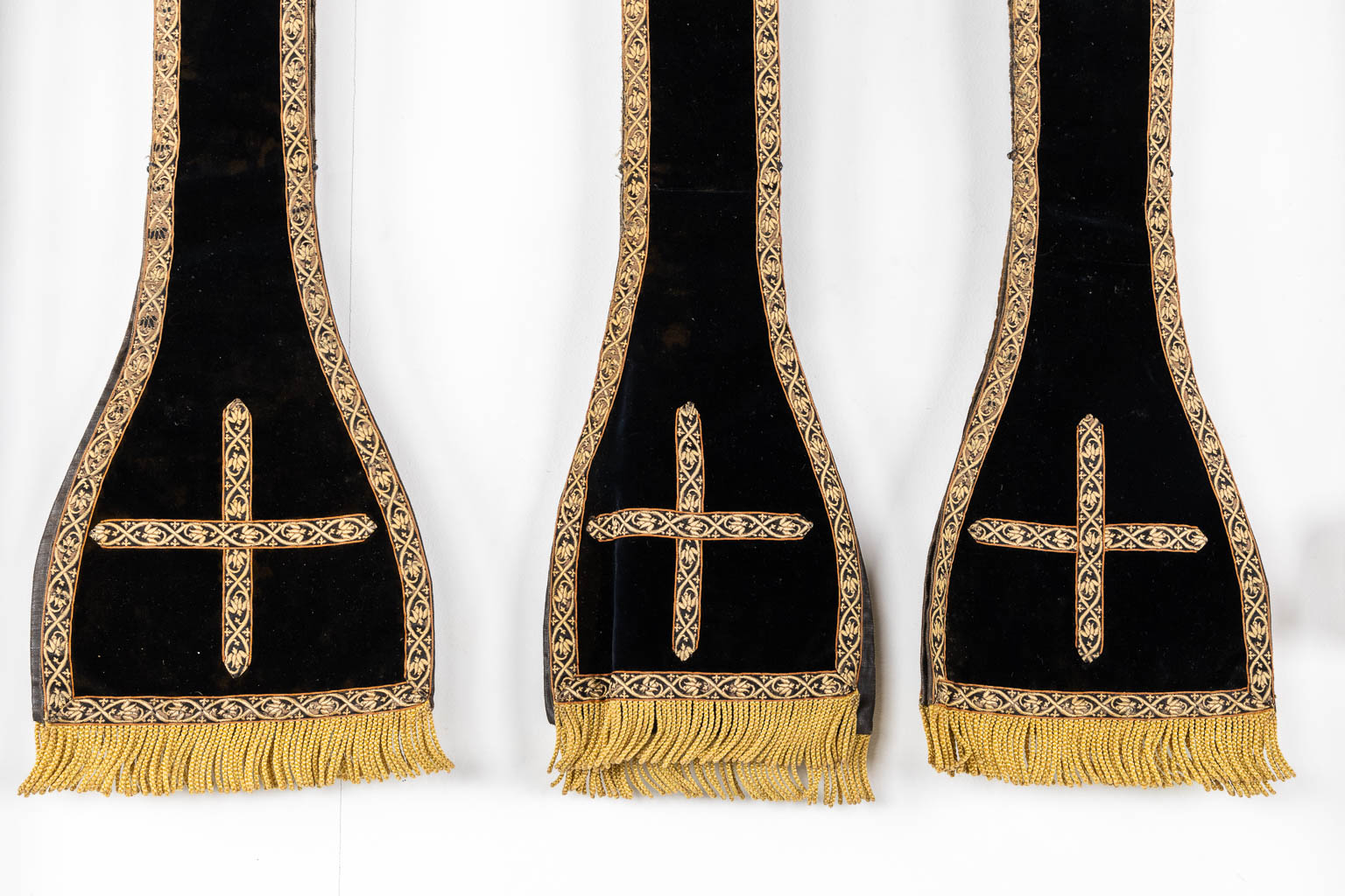 Two Dalmatics and a Roman Chasuble, added are a big collection of stola and maniple. 