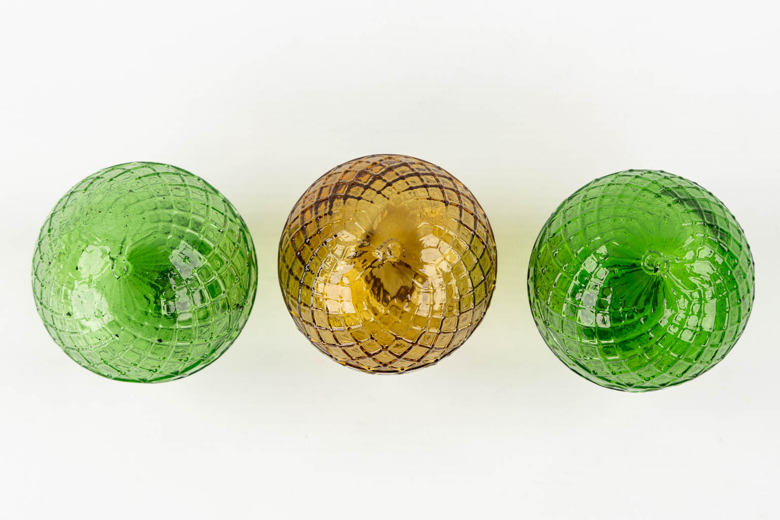 Gevelot Paris. Three antique target practice balls, Moulded glass, green and amber. 