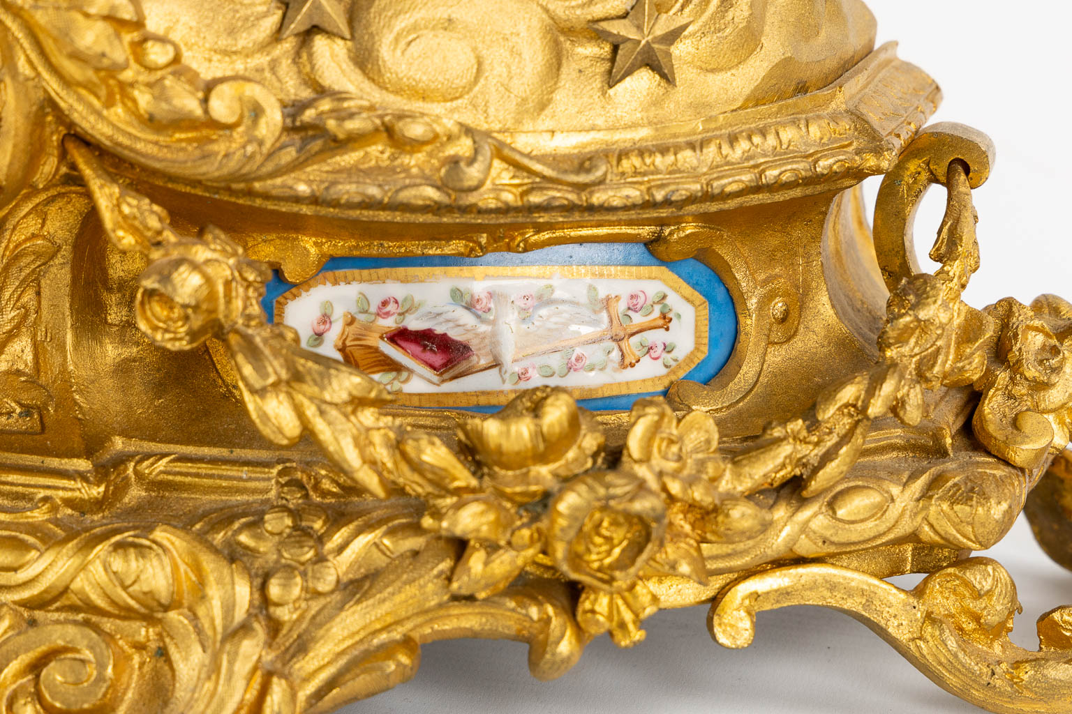 A three-piece mantle garniture clock and candelabra, gilt bronze and Sèvres porcelain, 19th C. (L:20 x W:53 x H:52 cm)