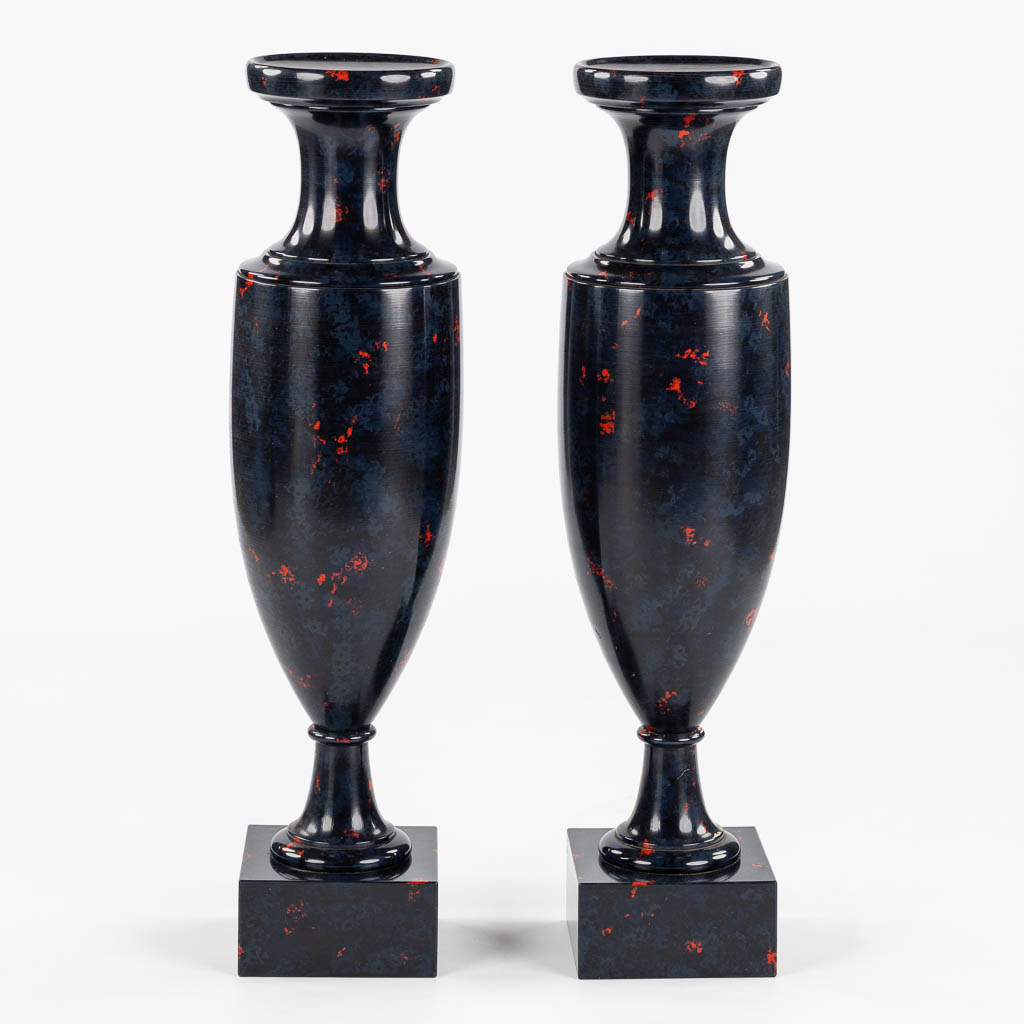 A pair of higly decorative and large urns, wood turned with a 'Faux Marble' decor.