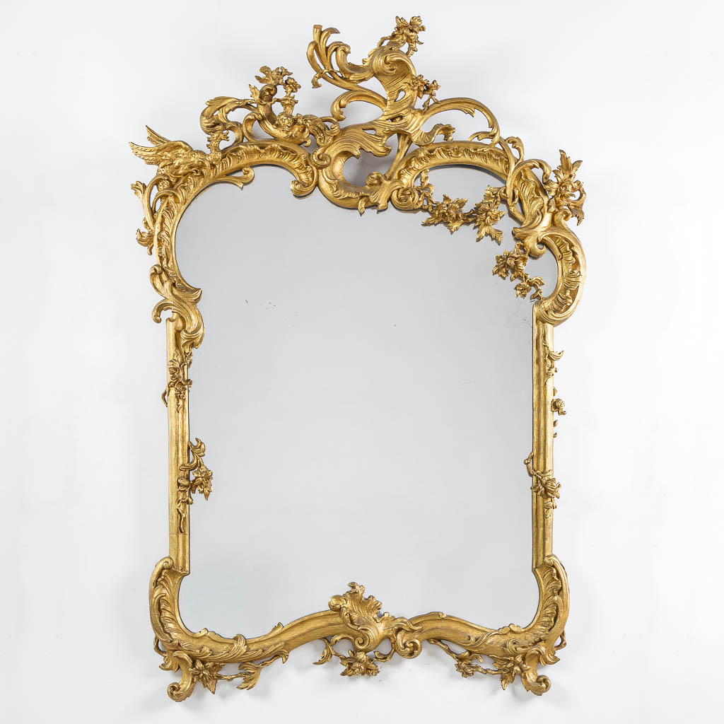 An antique wood-sculptured mirror, Louis XV style. Circa 1900. (W:93 x H:135 cm)