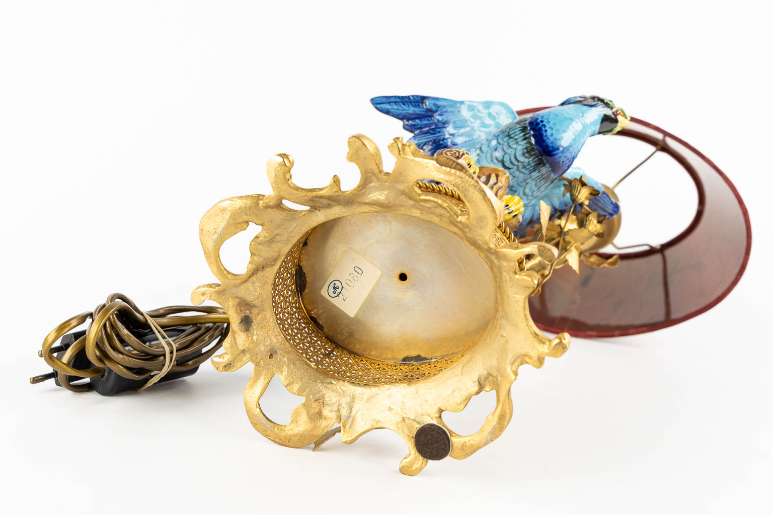 A decorative table lamp, brass mounted with polychrome porcelain. (L:16 x W:18 x H:45 cm)