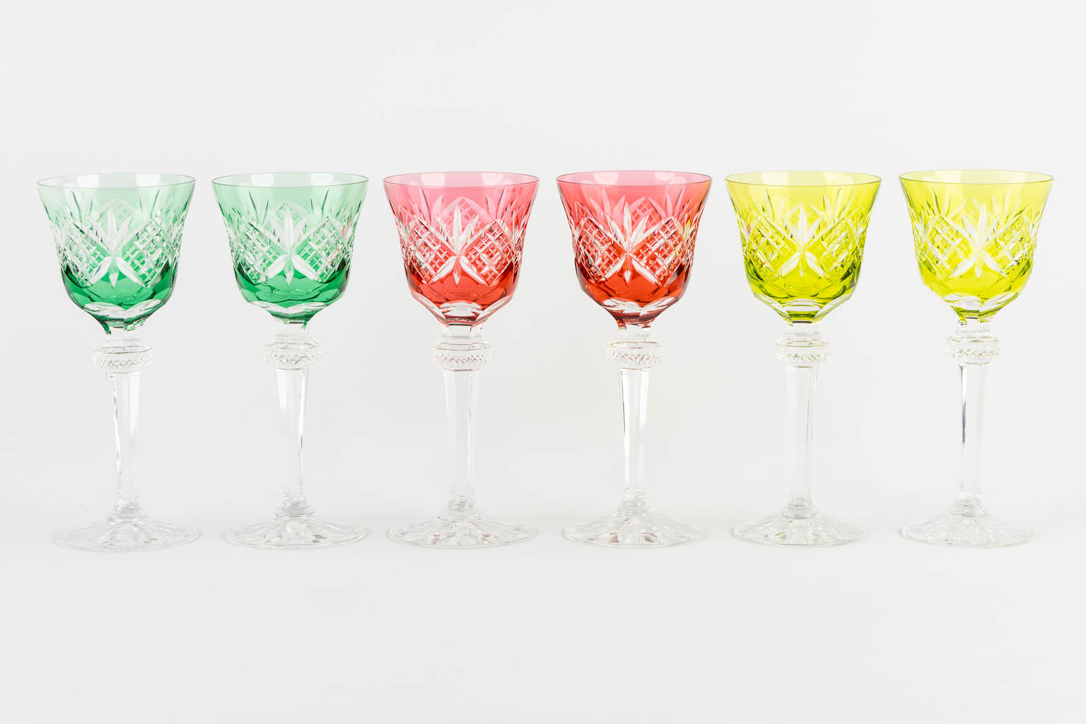 Cristallerie De Lorraine, 12 coloured goblets, added are 4 Val Saint Lambert goblets. (H:20 cm)