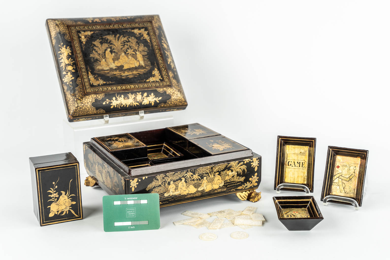 A Chinese Canton export game box, lacquered with hand-painted decors. 