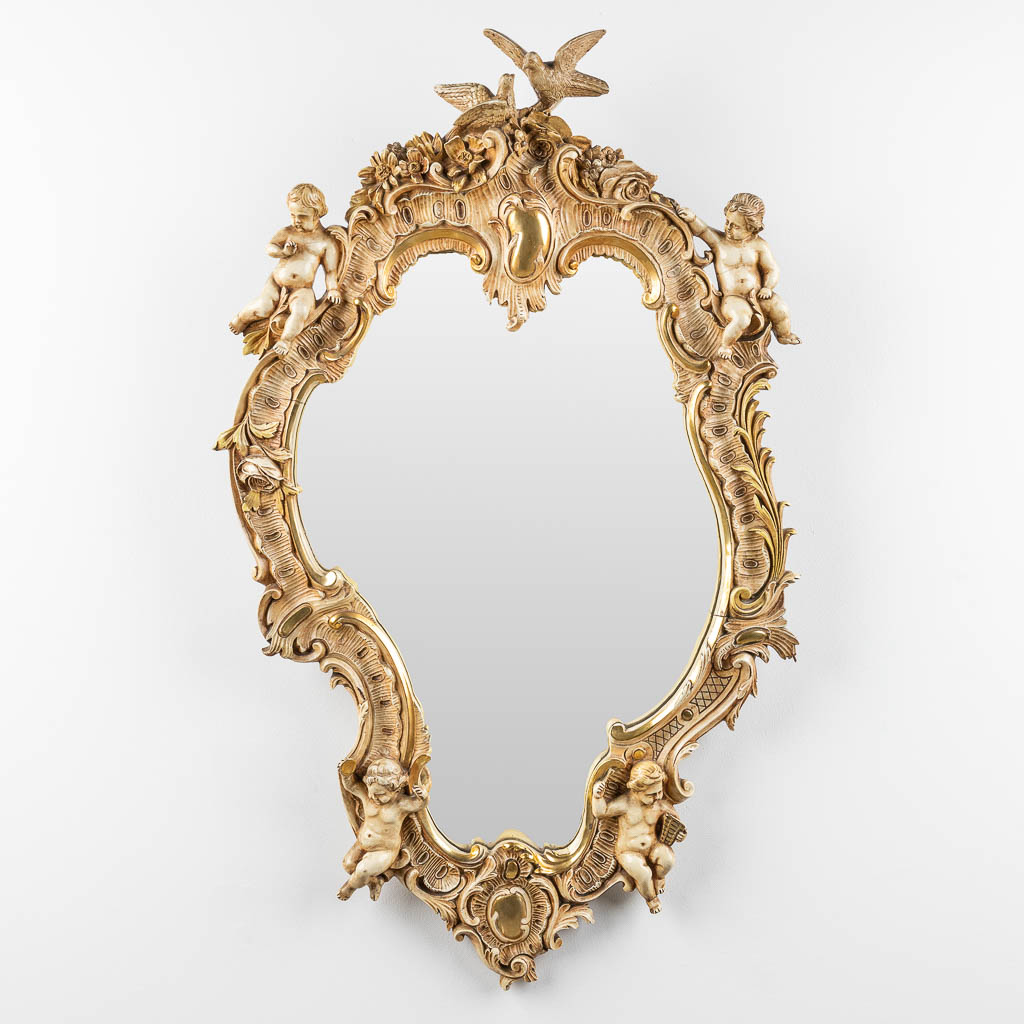 An antique mirror with musical putti. 1886. (W: 60 x H: 97 cm)