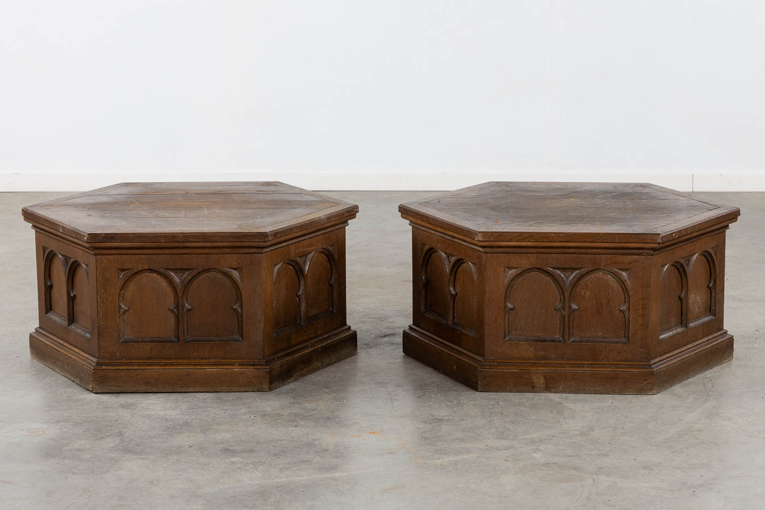 A pair of pedestals for large candelabra, sculptured oak, Gothic Revival. (H:40 x D:76 cm)