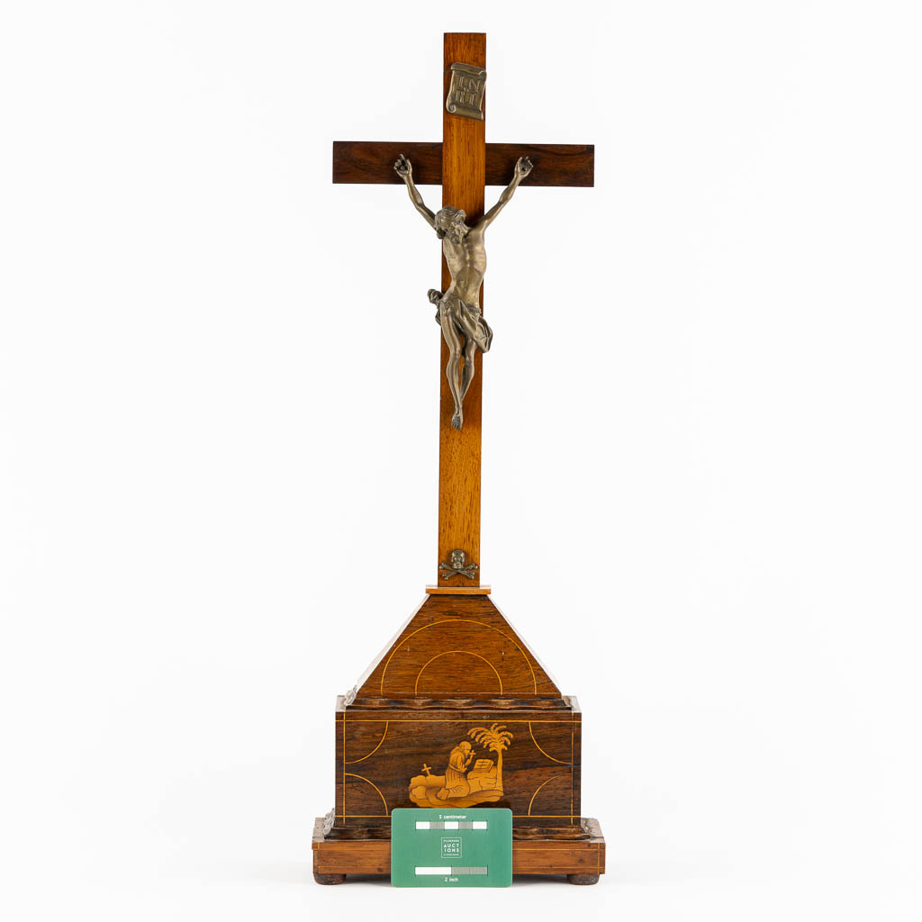 A bronze Corpus Christi mounted on a mahogany and marquetry inlay crucifix.