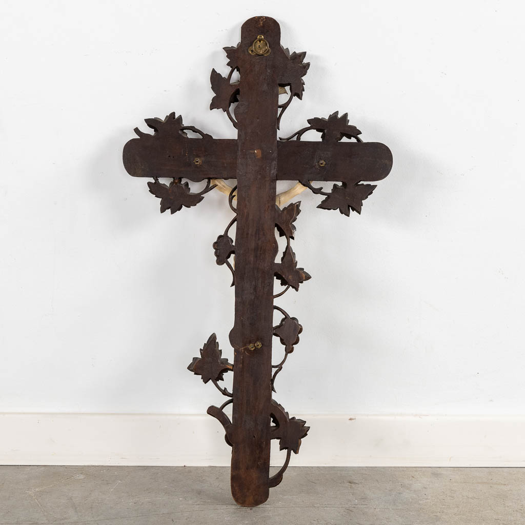 A wood-sculptured crucifix with an ivory 