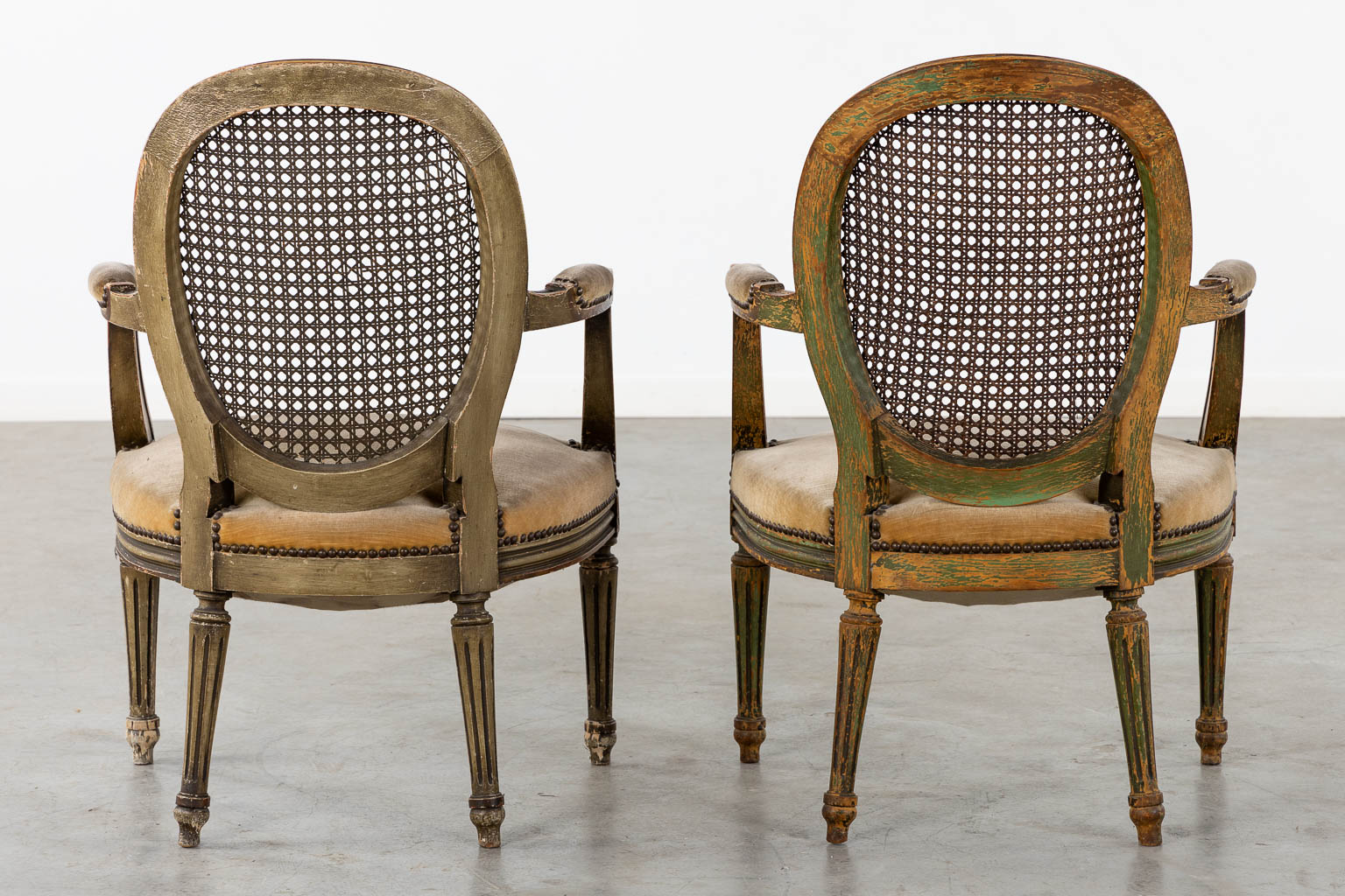 A pair of antique patinated chairs, Louis XVI style. (L:58 x W:57 x H:83 cm)