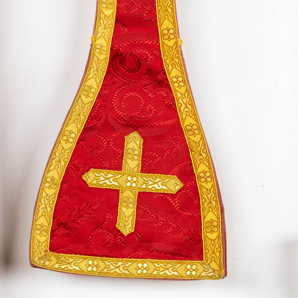 Two Dalmatics and a Roman Chasuble, added are a big collection of stola and maniple. 