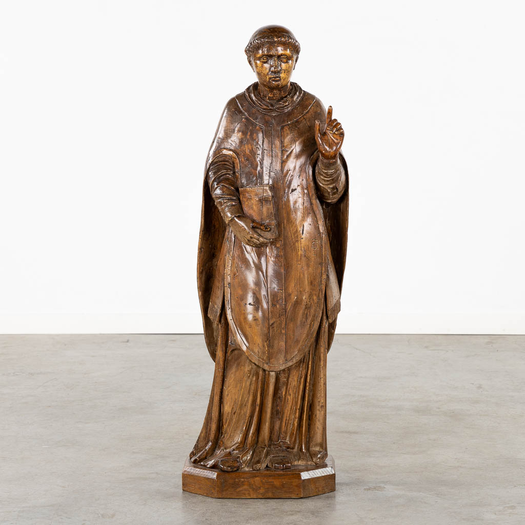 An antique wood-sculptured figurine of Saint Lawrence, 18th/19th C. (L:27 x W:33 x H:106 cm)