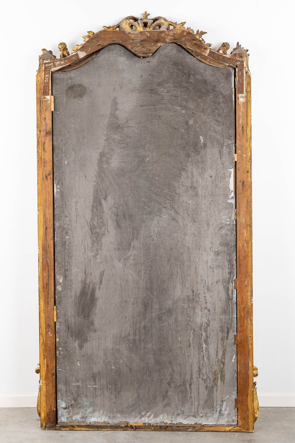 A mirror, sculptured wood, and stucco in a Louis XV style. 20th C. (W:110 x H:218 cm)