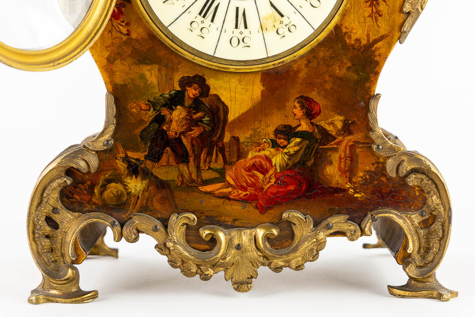 A cartel clock, hand-painted floral decor, mounted with bronze. (c.1900). 