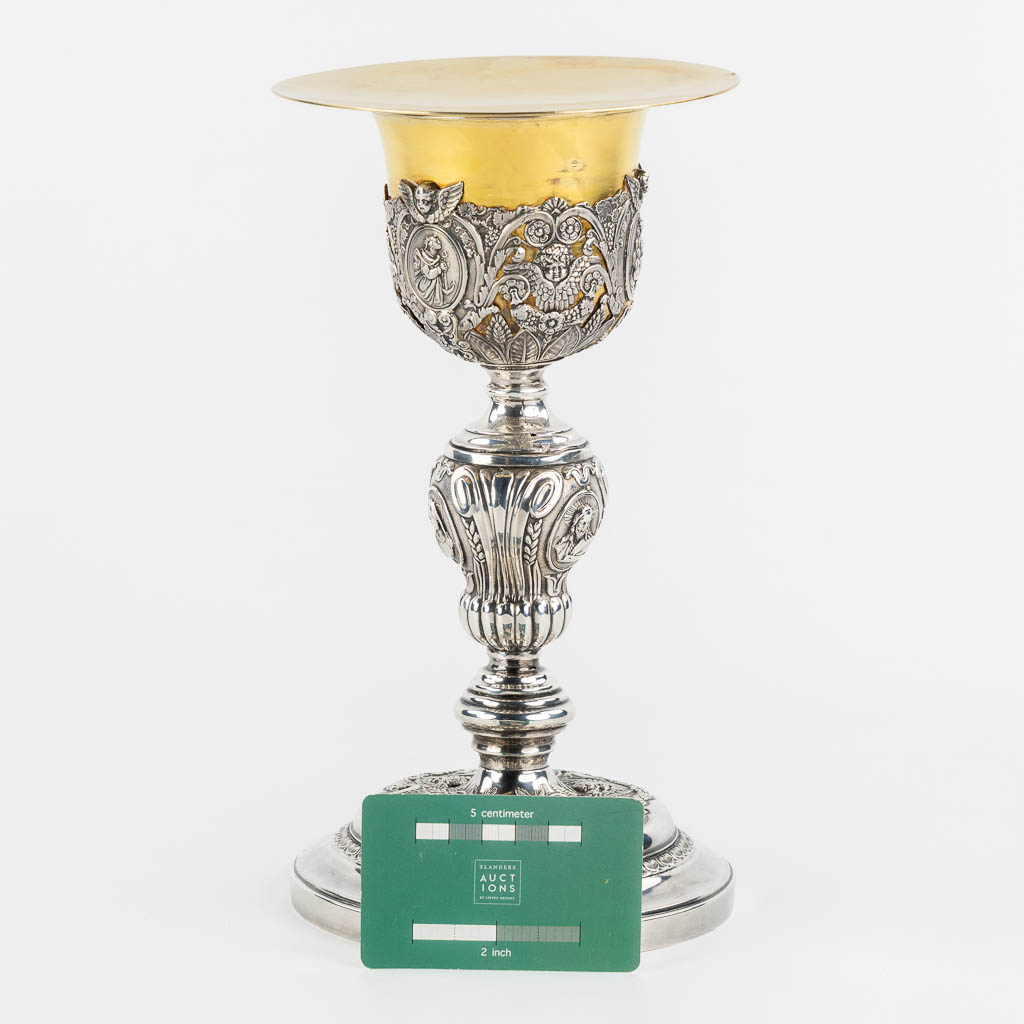 A silver chalice with a vemeil cuppa, rich decor in Baroque style. 19th C. (H:26 x D:14 cm)