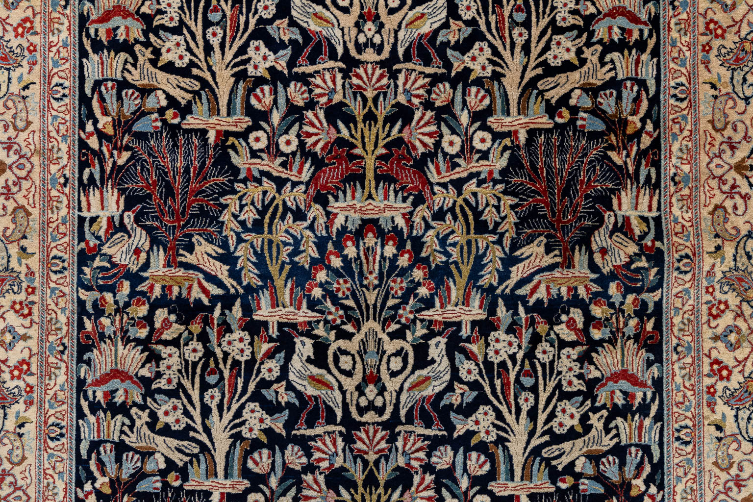 An Oriental hand-made carpet, birds and trees, Isphahan/Isfahan. (L:181 x W:107 cm)