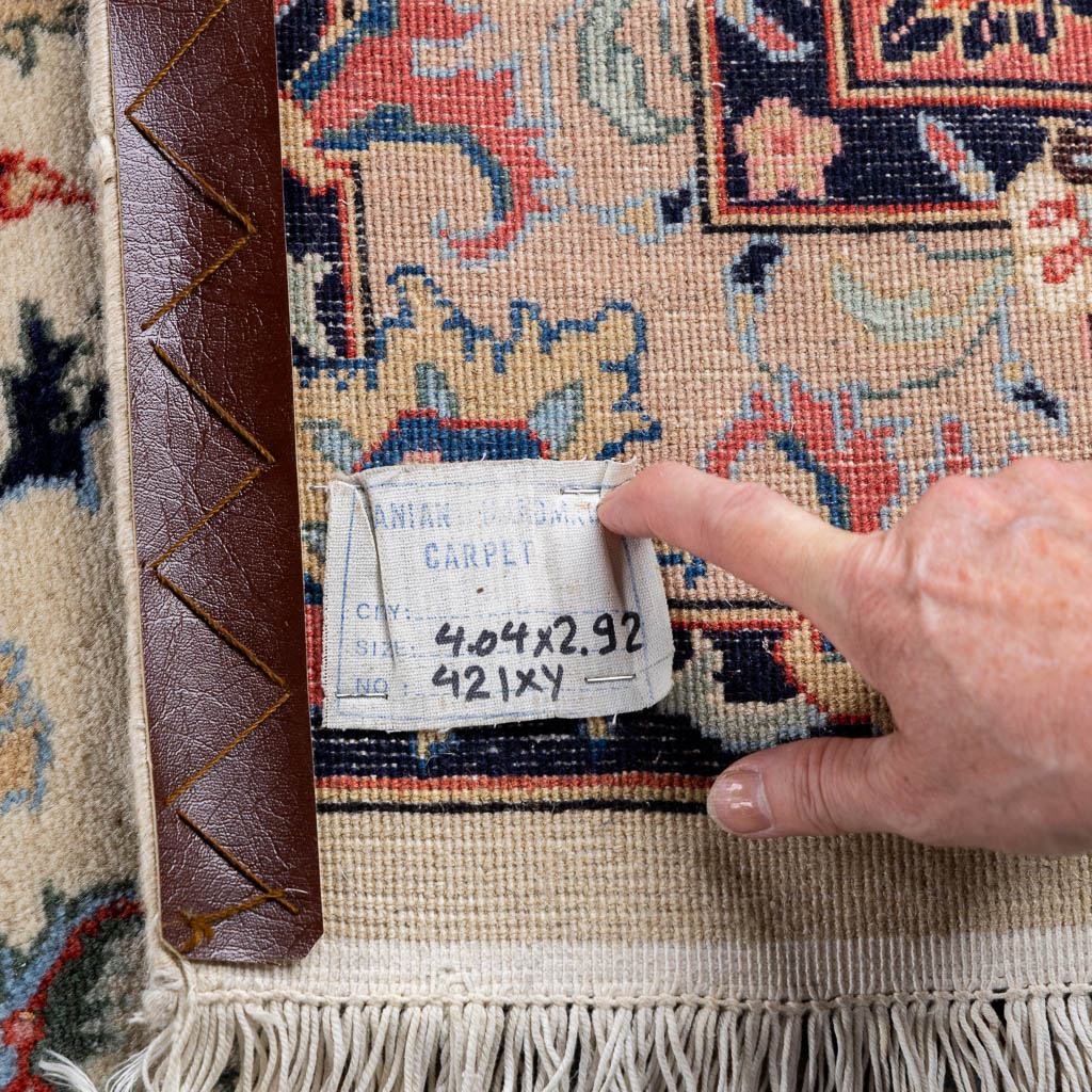 A large Oriental hand-made carpet, Kashan. (L:408 x W:290 cm)