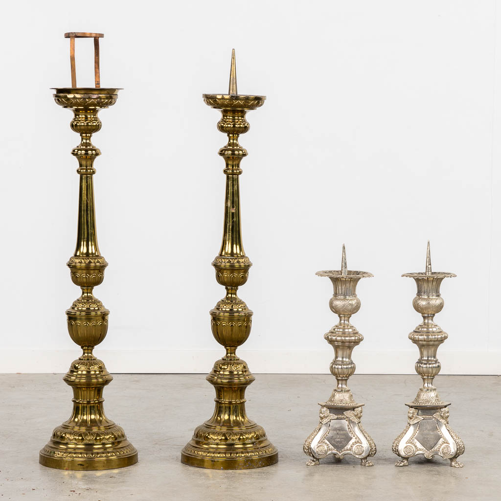 A pair of silver-plated church chandelsticks, added a pair of brass candelabra. (H:92 cm)