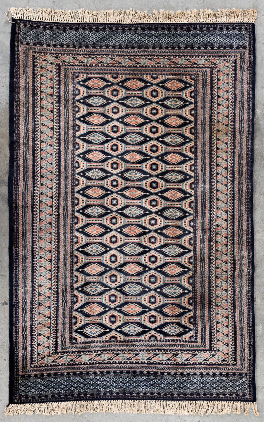 An Oriental hand-made carpet Buchara/Bokhara. (L:199 x W:126 cm)