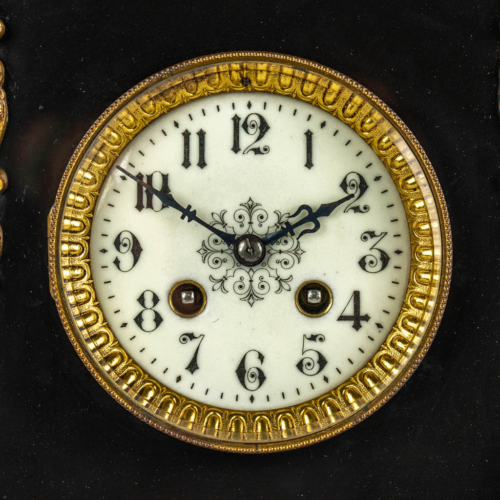 A Neoclassical three-piece mantle garniture clock and side pieces, marble and bronze. 19th C.