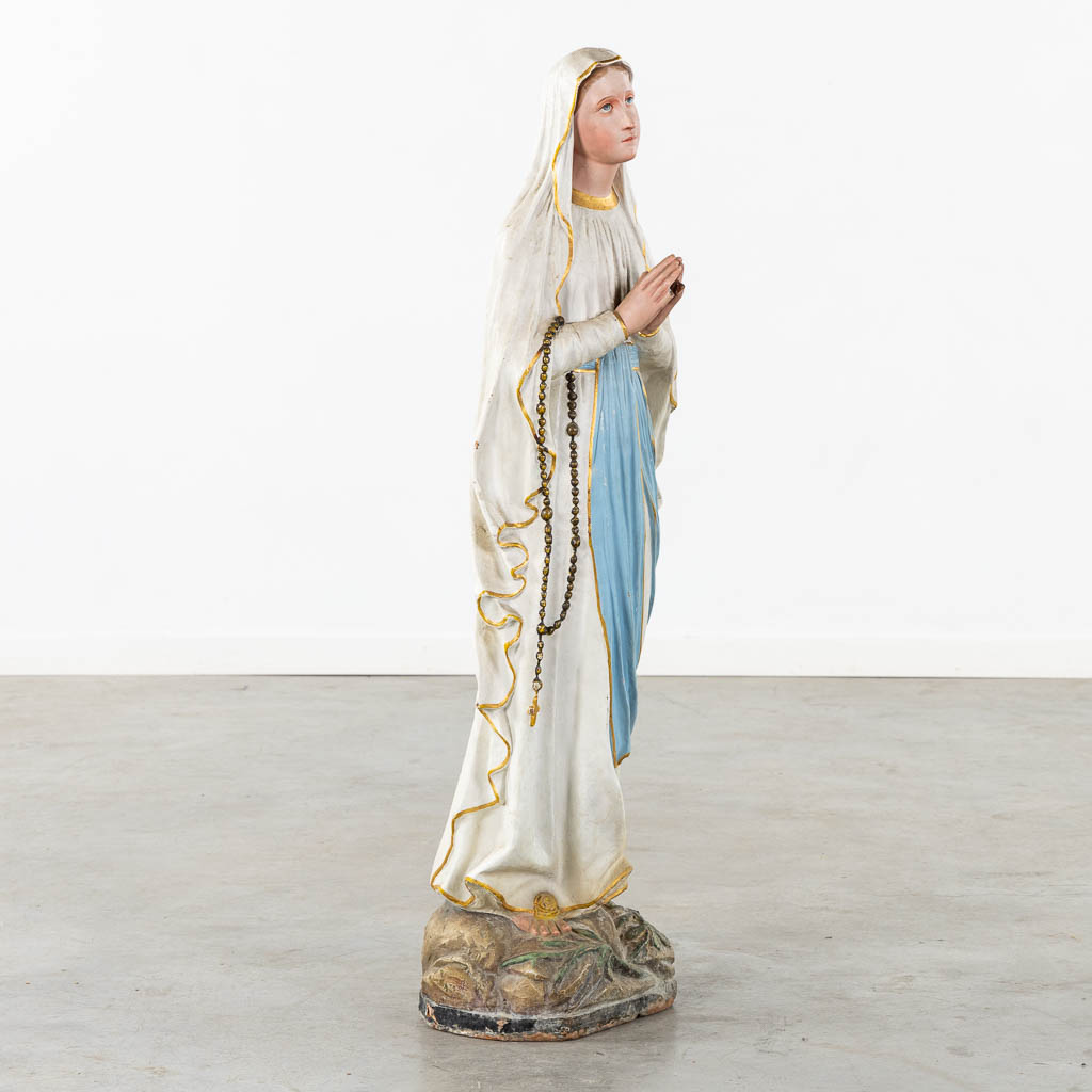 A patinated terracotta figurine of Our Lady of Lourdes. 19th C. (H:110 cm)