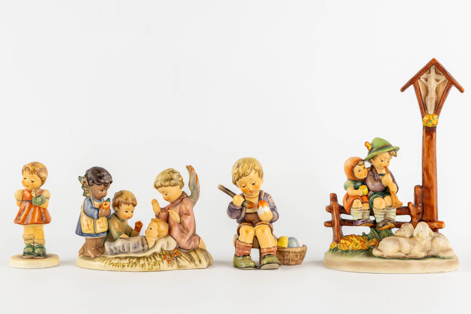 Hummel, 14 figurines, some with original boxes. (H:19 cm)