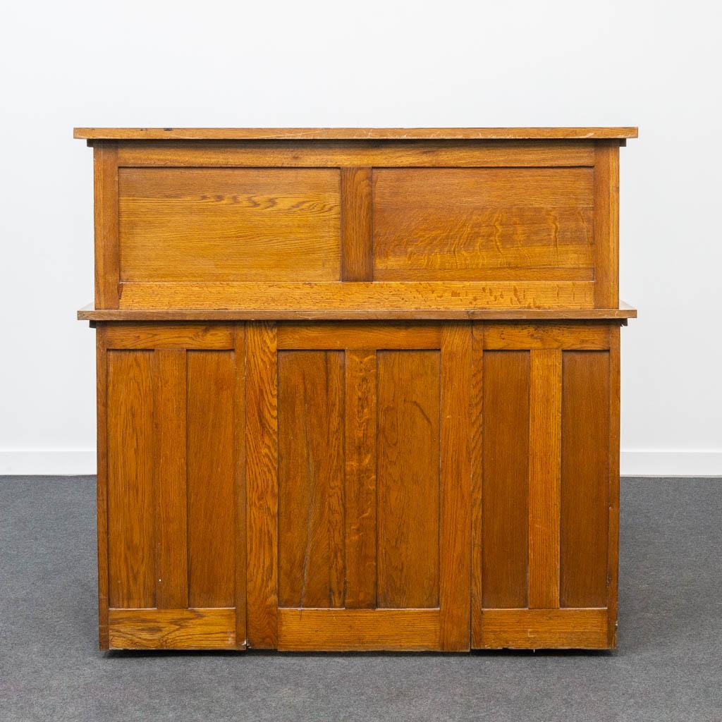 A wood American rolltop desk. (L:123 x W:75 x H:116 cm)