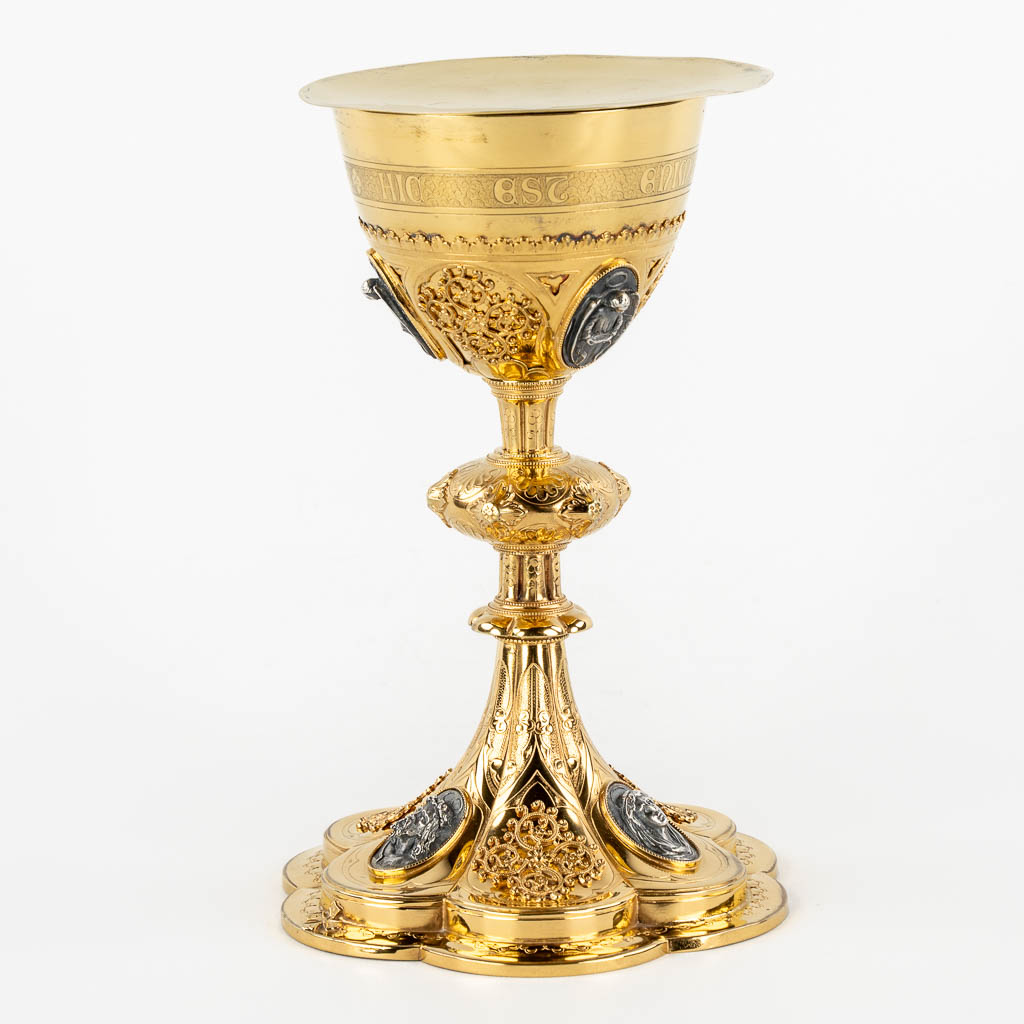 A Gothic Revival chalice with enamel plaques, cabochons. Silver Cuppa, Gilt brass, 19th C.