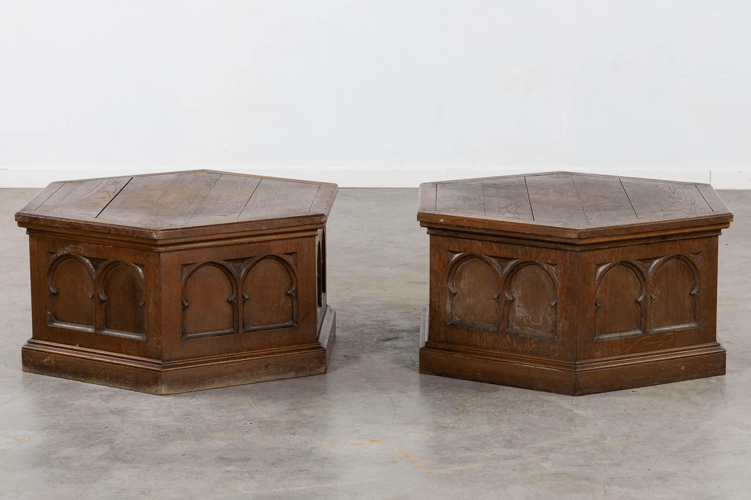 A pair of pedestals for large candelabra, sculptured oak, Gothic Revival. (H:40 x D:76 cm)