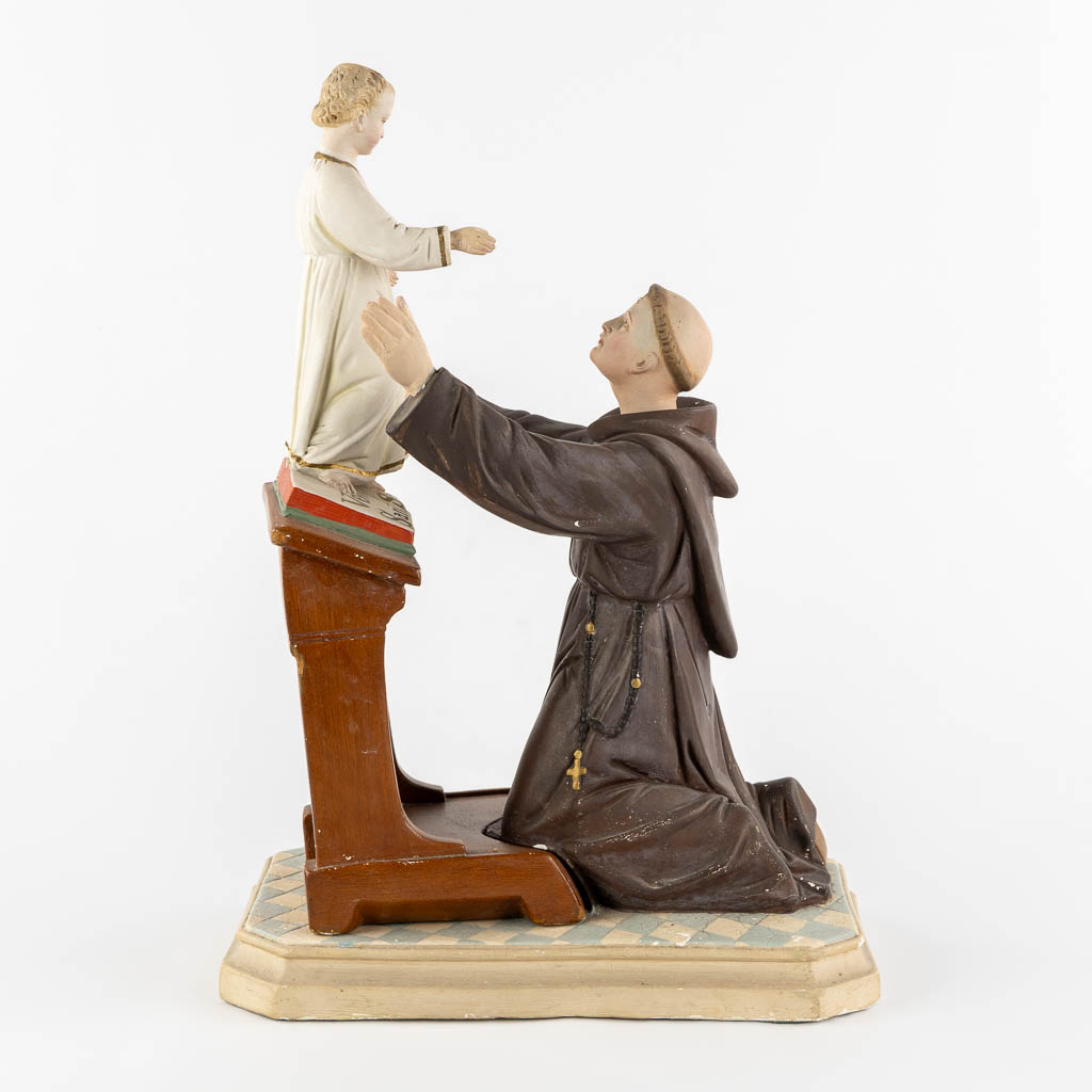 Saint Anthony with a child, polychrome plaster. Circa 1900. (L:20 x W:32 x H:44 cm)