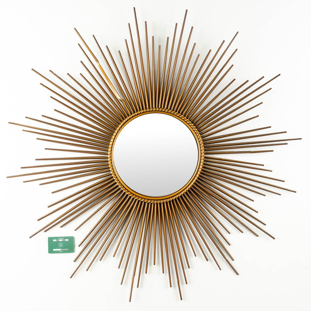 Chaty Vallauris, a large sunburst mirror. Gilt metal.  