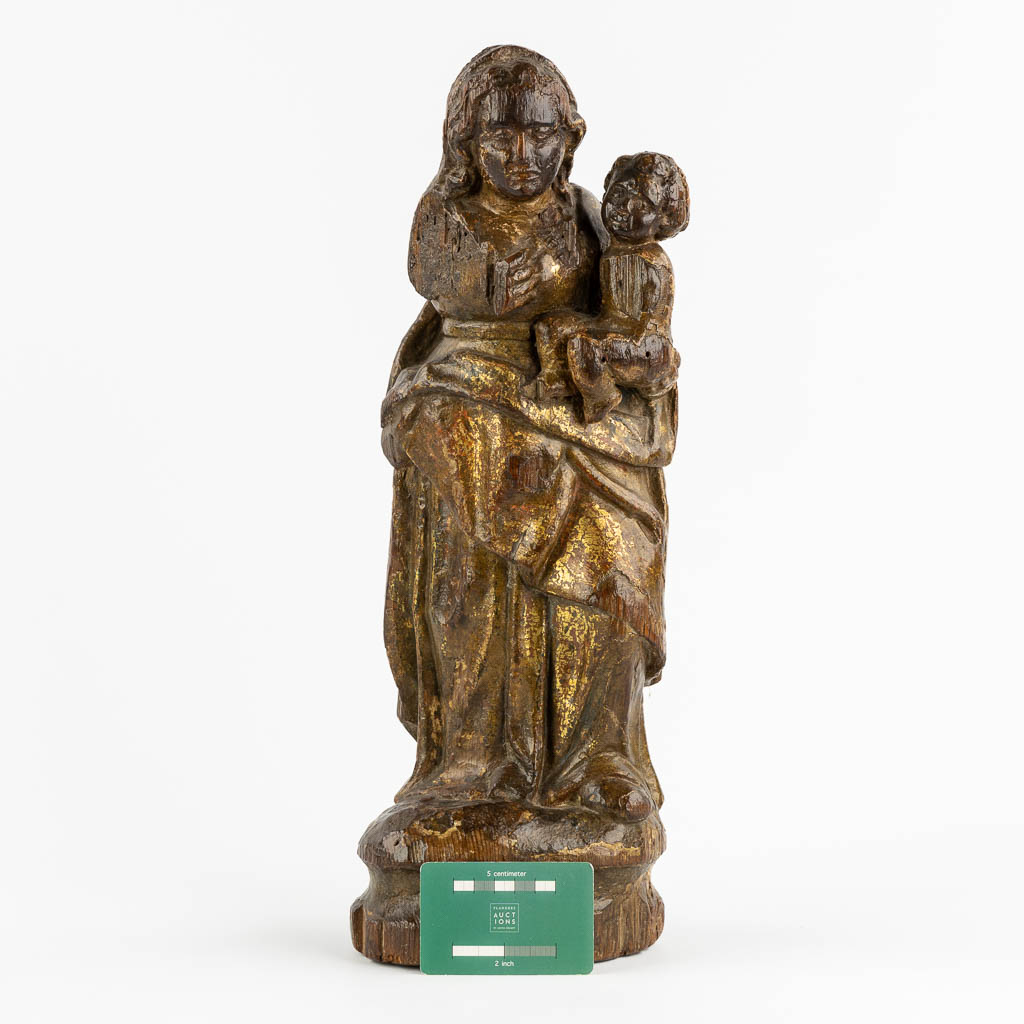 An antique wood-sculptured figurine of Madonna with a Child. 17th/18th C. (L:12 x W:16 x H:46 cm)