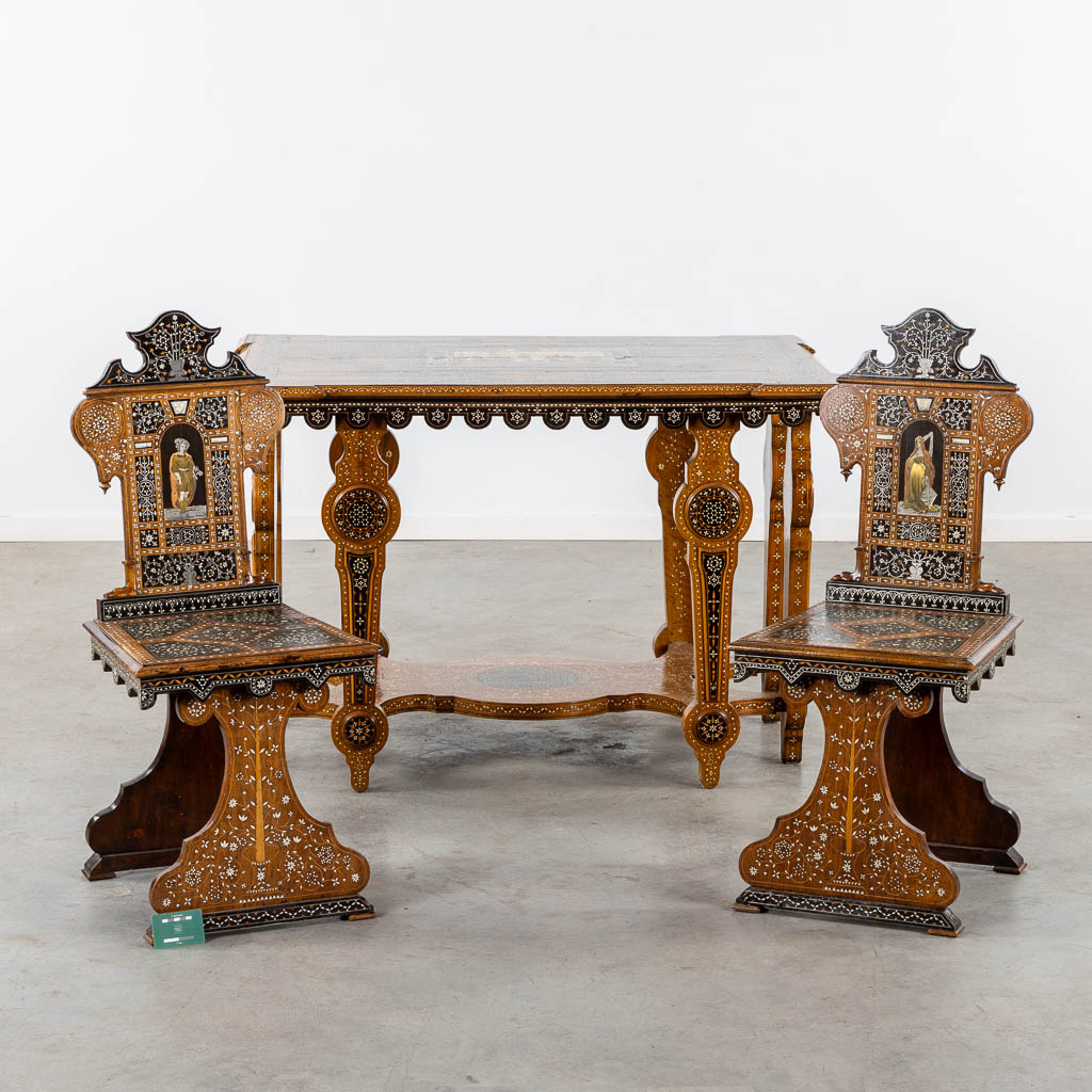 A Syrian table with two matching chairs, Marquetry and copper inlay, 19th C. (L:87 x W:121 x H:80 cm)