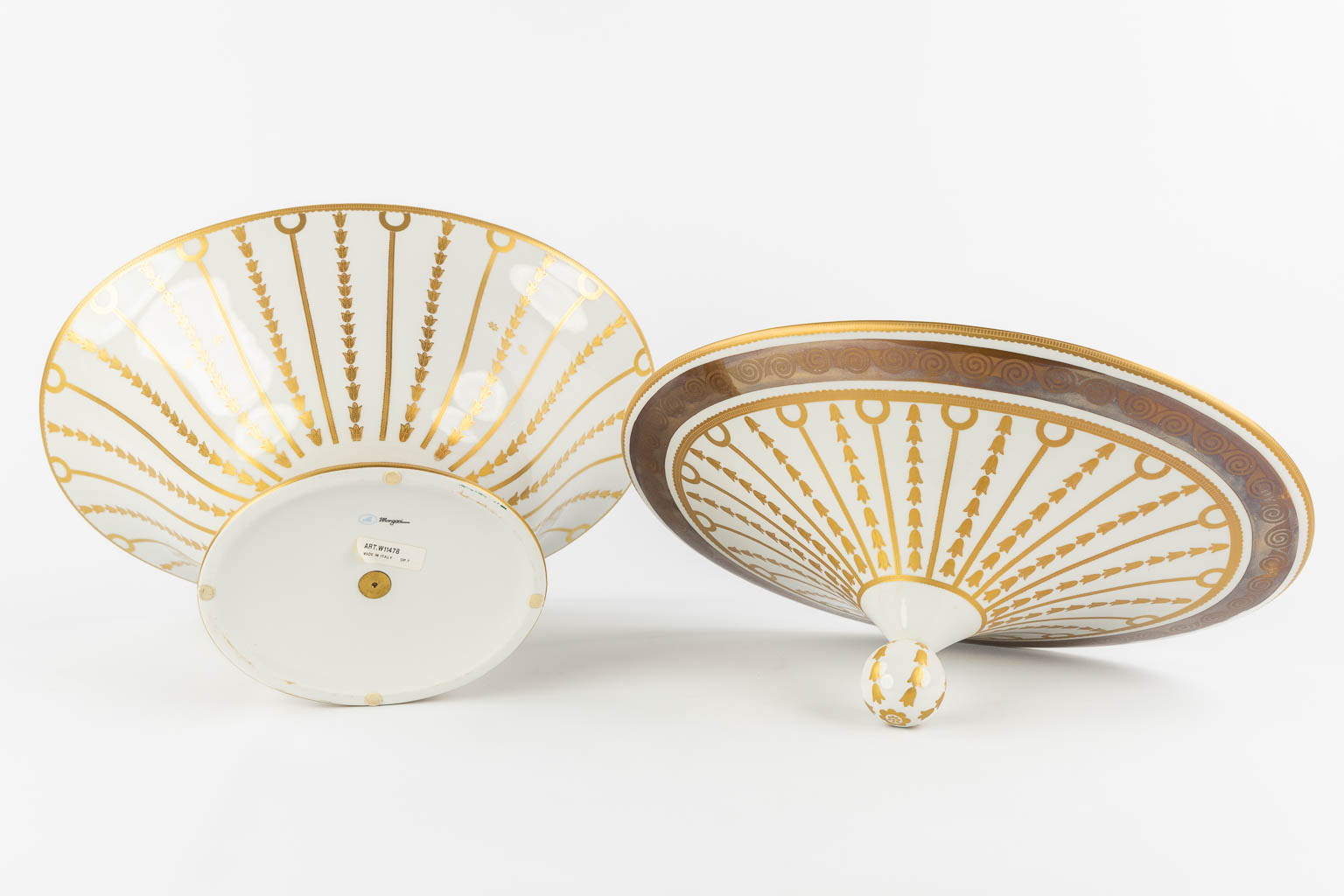 Mangani, Italy, a three-piece garniture, gilt porcelain in Empire style. (L:32 x W:43 x H:40 cm)