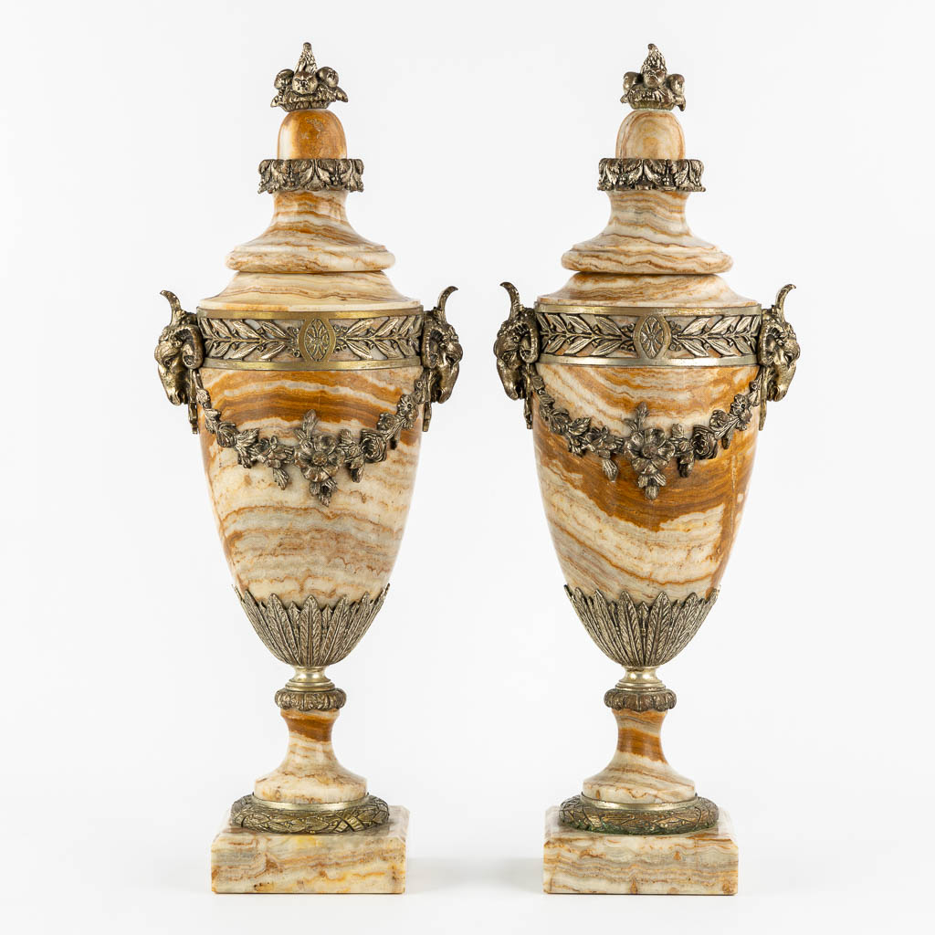 A pair of bronze mounted marble cassolettes with Ram