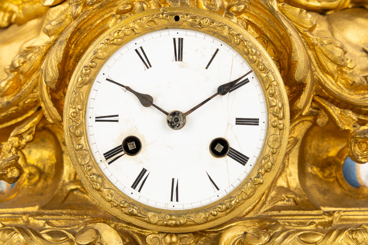 A three-piece mantle garniture clock and candelabra, gilt bronze and Sèvres porcelain, 19th C. (L:20 x W:53 x H:52 cm)