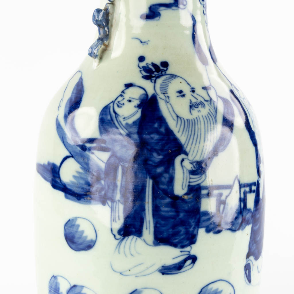 A Chinese vase, blue-white decor with wise men and children. (H:56,5 x D:21 cm)