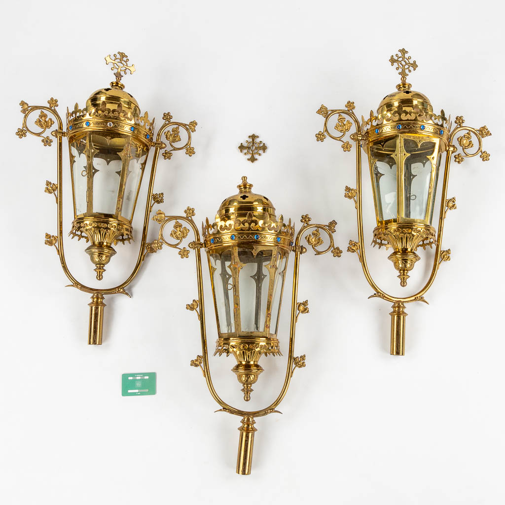 Three Processional lanterns, brass finished with cabochons, Gothic Revival. (W:48 x H:82 cm)