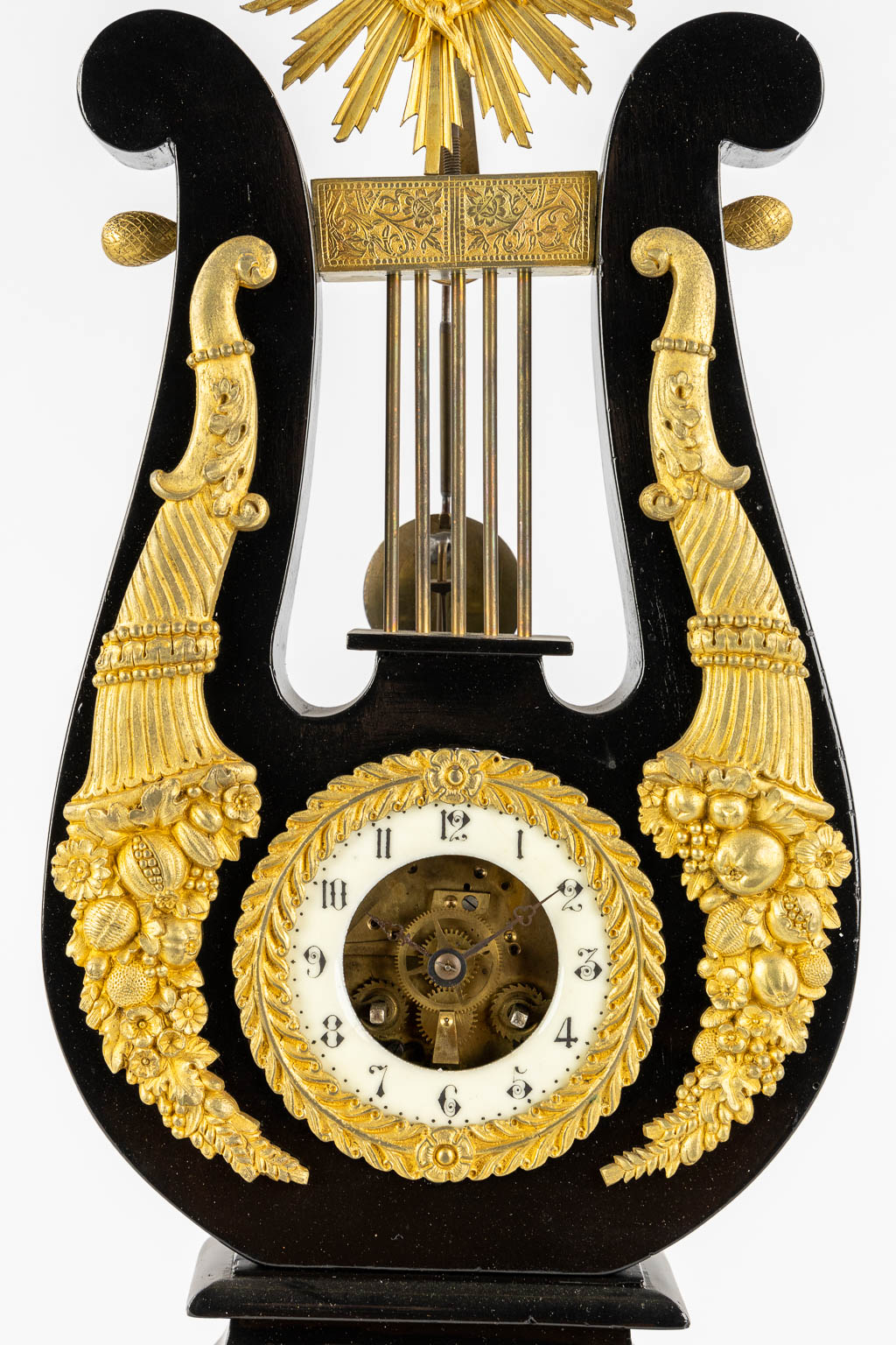 A Lyre mantle clock, gilt bronze and marble. 19th C. (L:13 x W:22 x H:61 cm)