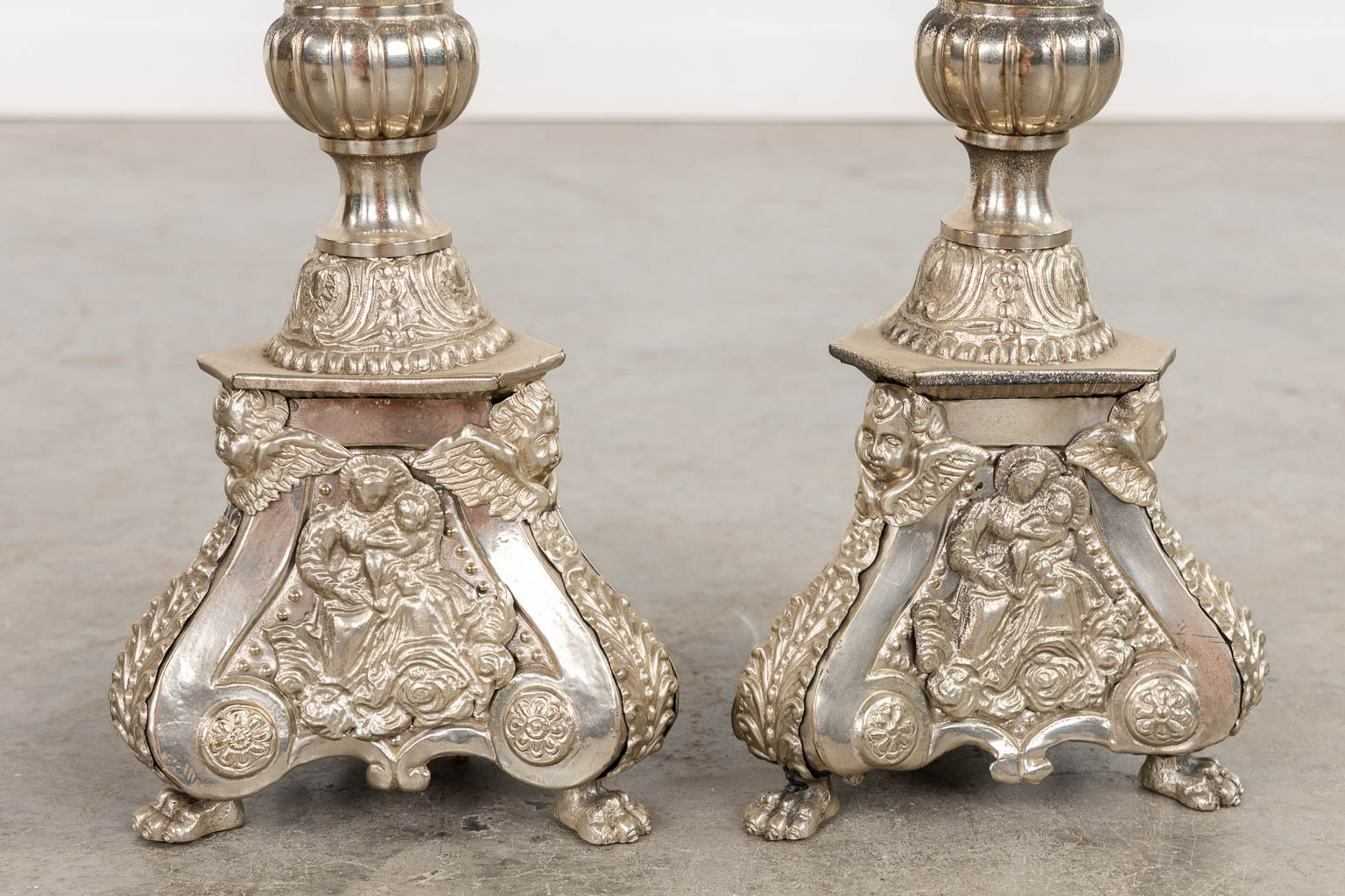 A pair of silver-plated church chandelsticks, added a pair of brass candelabra. (H:92 cm)