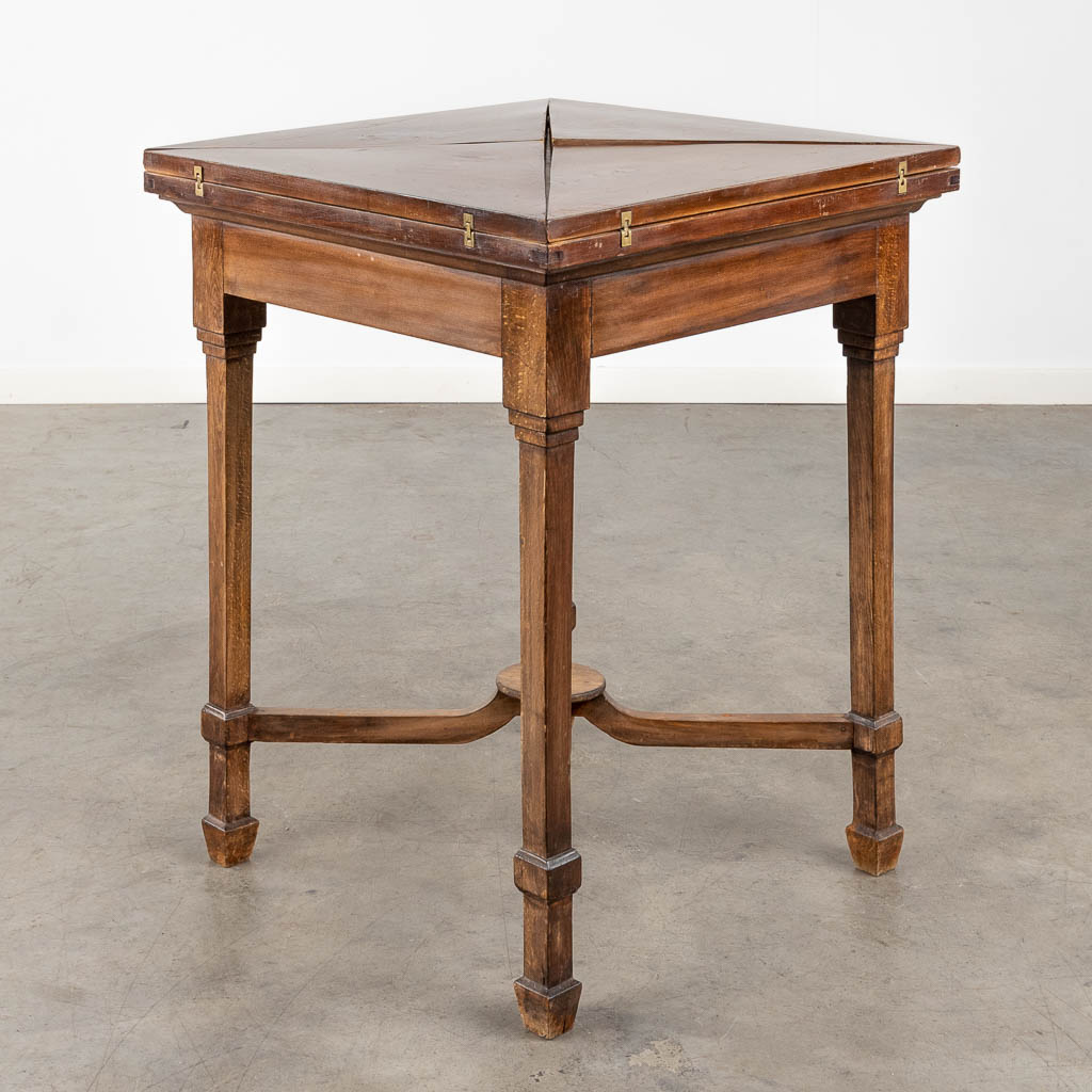 An antique game table with folding top. 19th C. (L:84 x W:84 x H:77 cm)